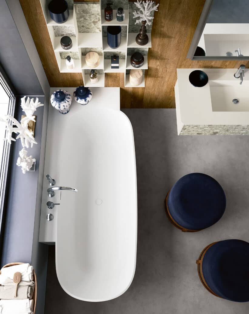 Round bathtubs standing against a wall or corner, same-colour structure — Tecnoril: non-porous, anti-bacterial, fire and scratch resistant