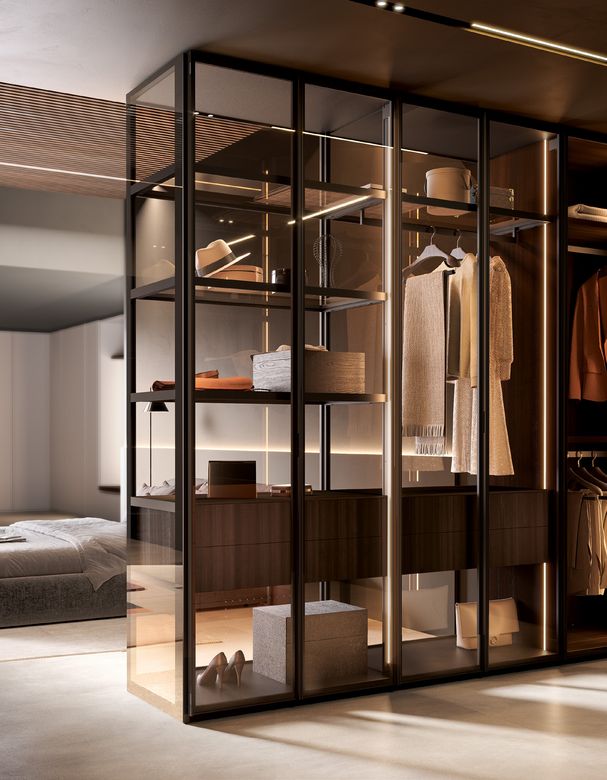 Custom wardrobe — Glass-front wardrobe beside the bed