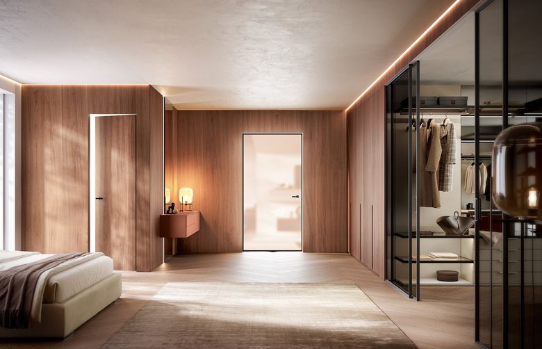 Custom wardrobe — Bedroom with wall panelling and a glass-front walk-in