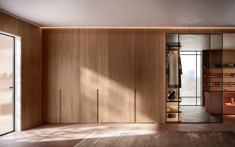 Custom wardrobe — Wardrobe wall opening to a glazed walk-in