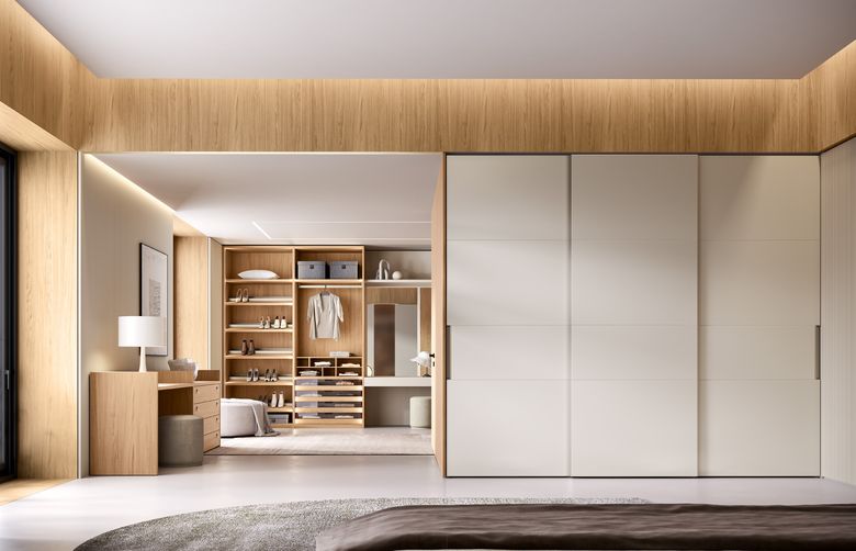 Custom wardrobe — Sliding leather doors opening to a walk-in