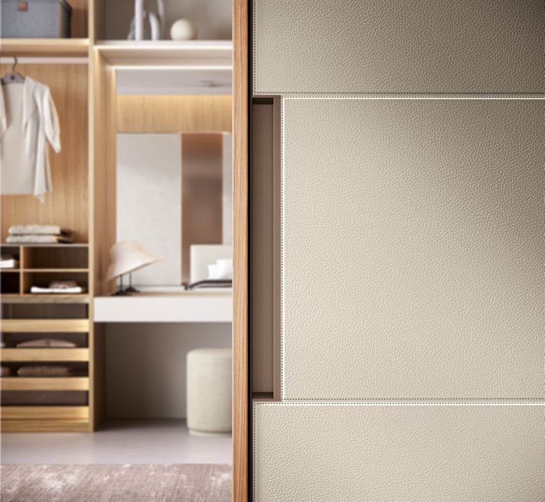 Custom wardrobe — Walk-in seen past the sliding door edge