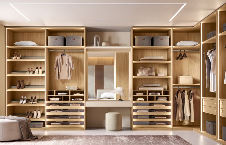 Custom wardrobe — Walk-in with a central vanity and mirror