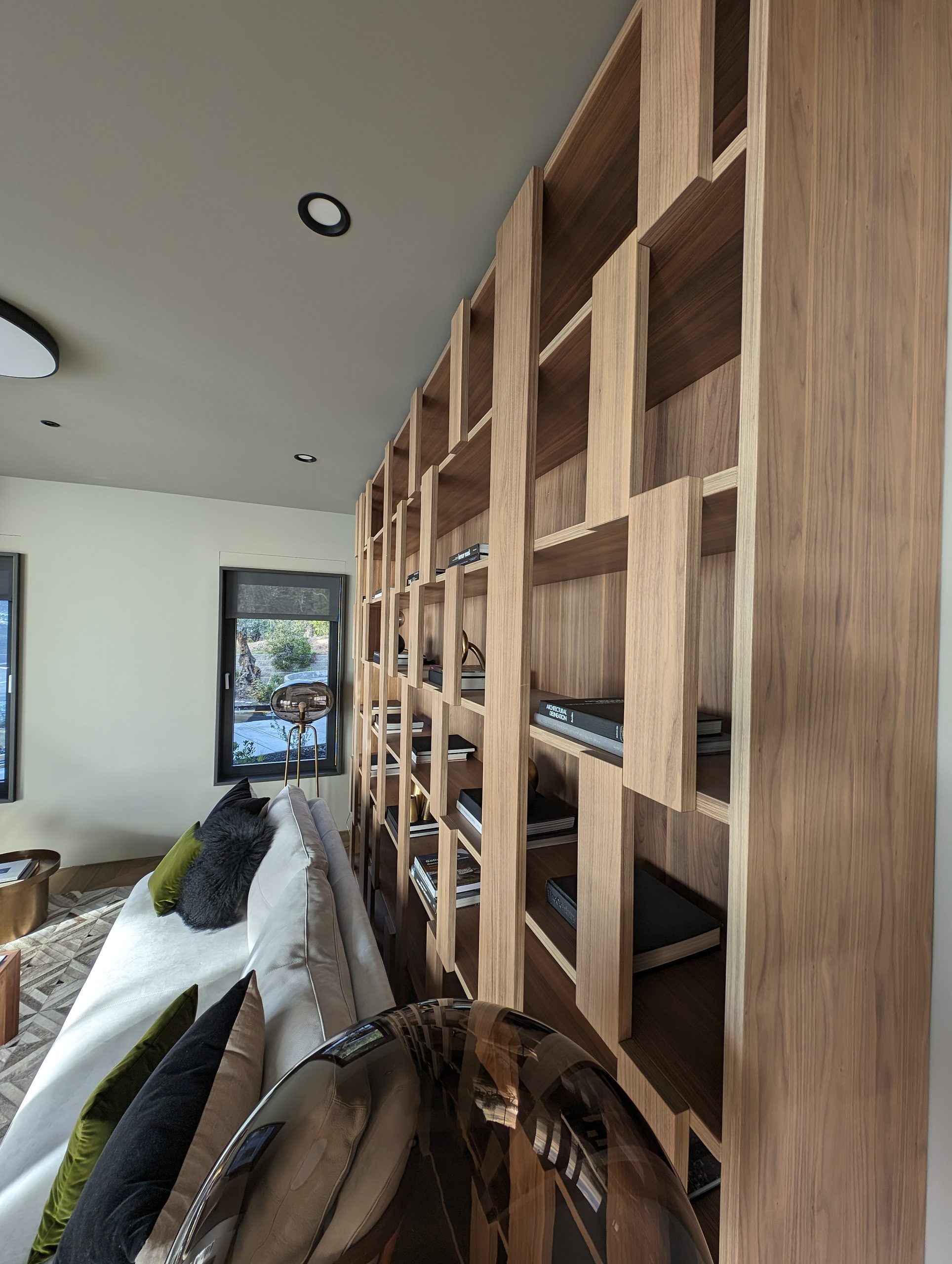 Detail of the open-grid library shelving, oak with varied compartment sizes
