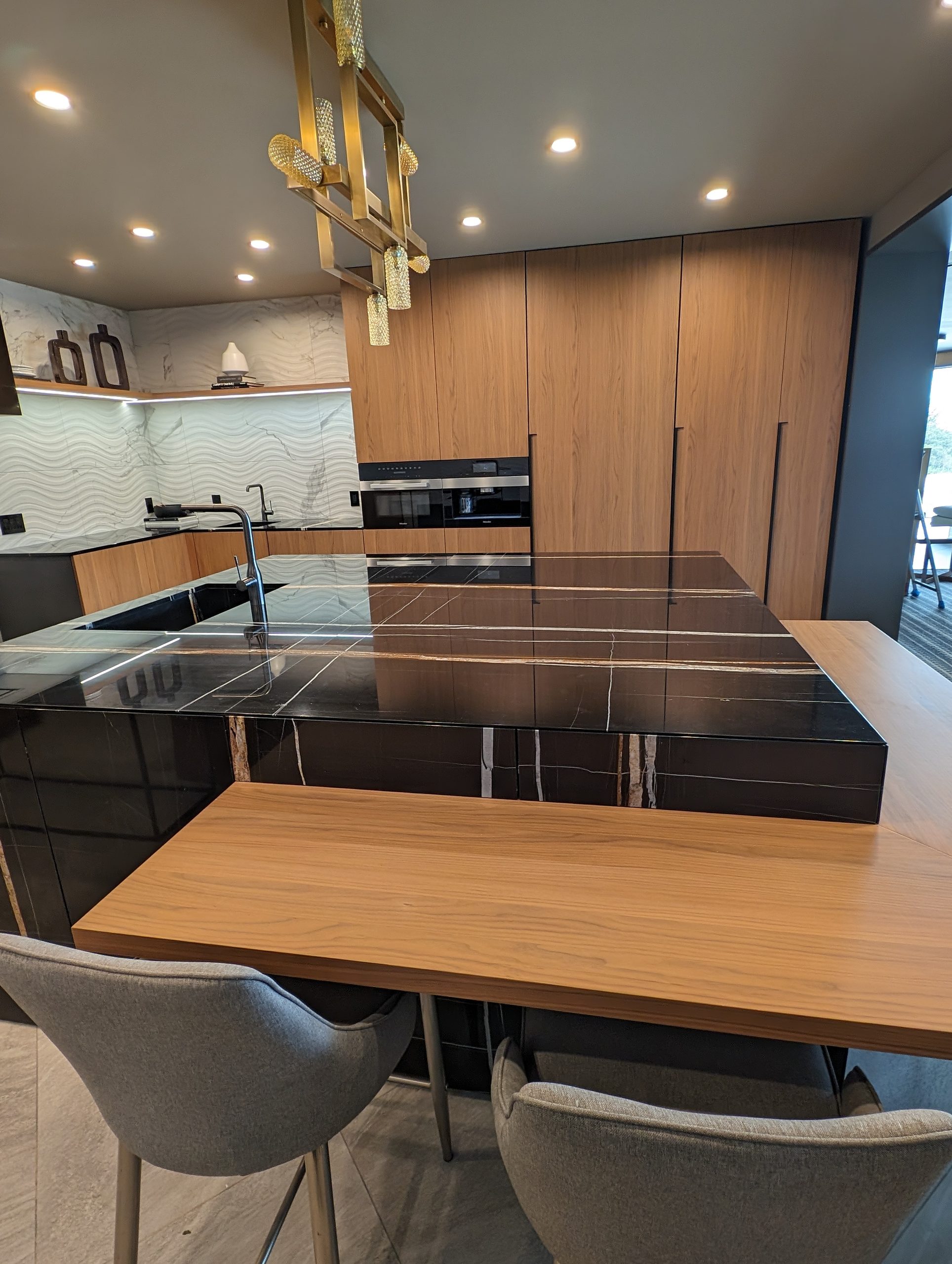 Kitchen island with an integrated solid walnut dining table extension