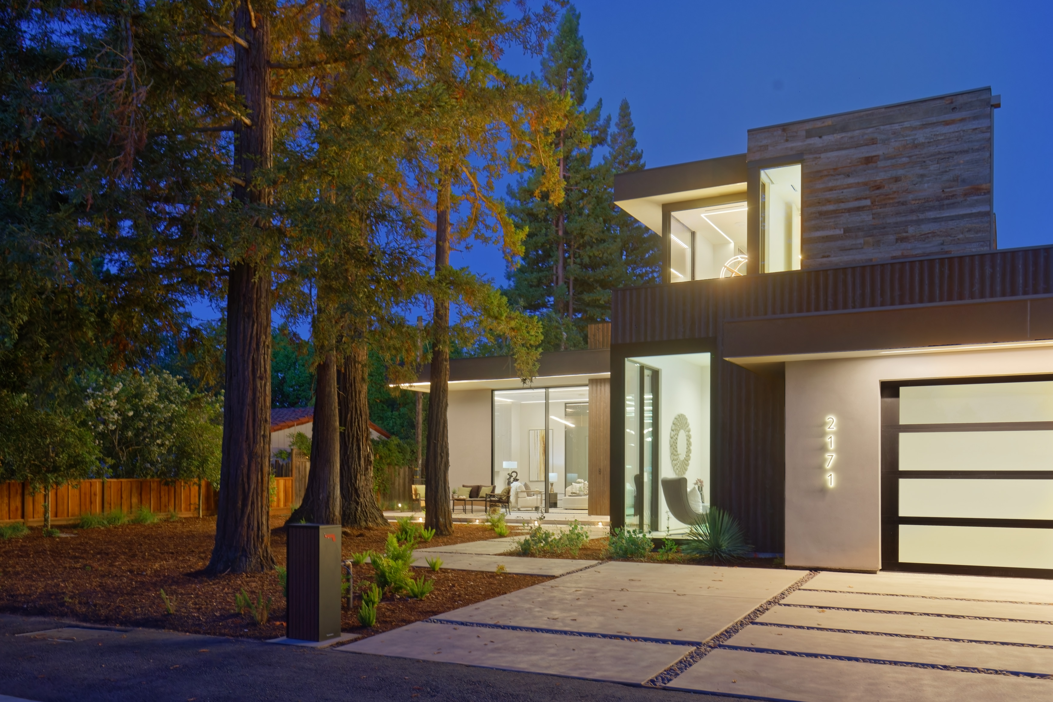 Menlo Park residence — front elevation at dusk among redwoods