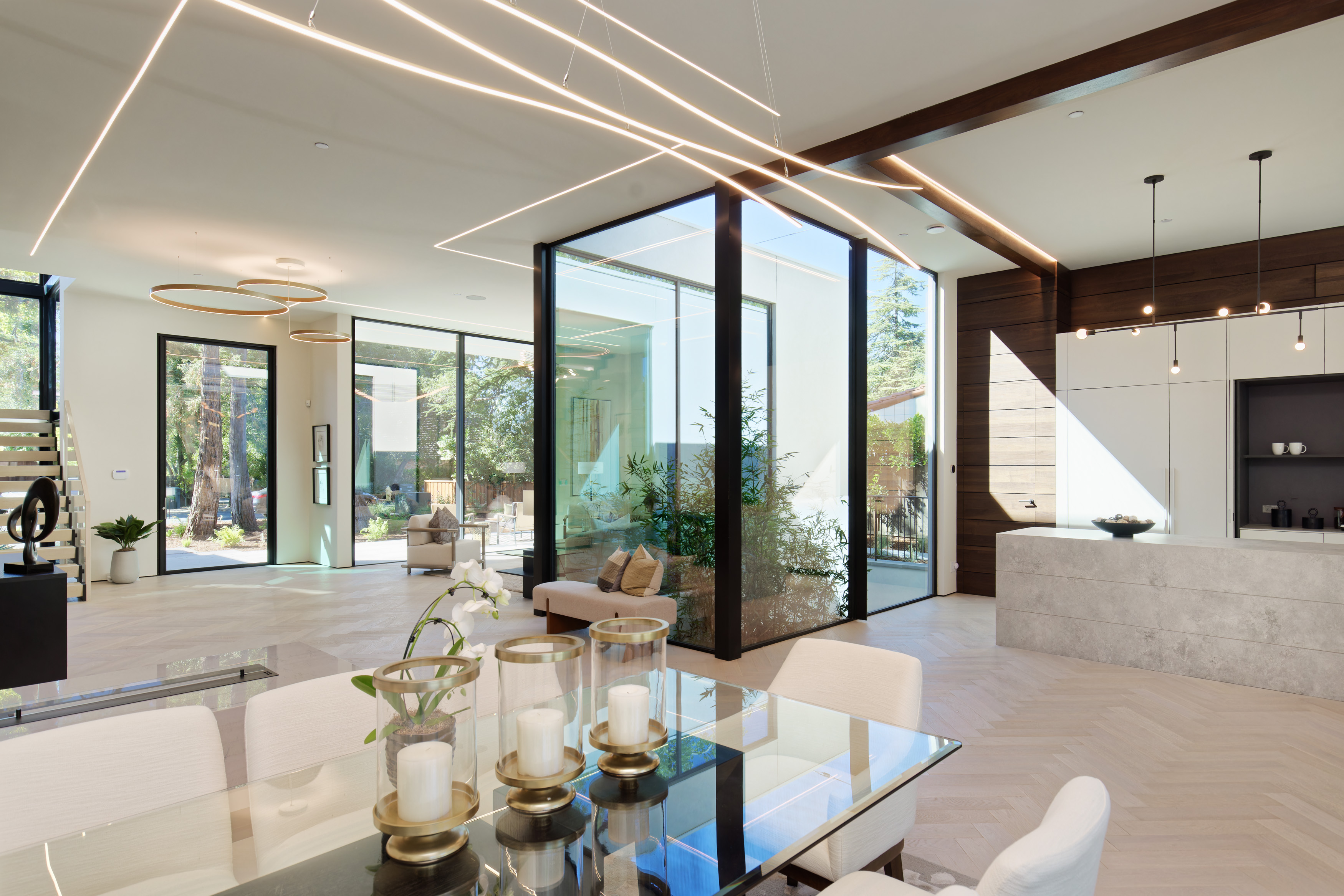 Open-plan great room with glass courtyard and interior doors