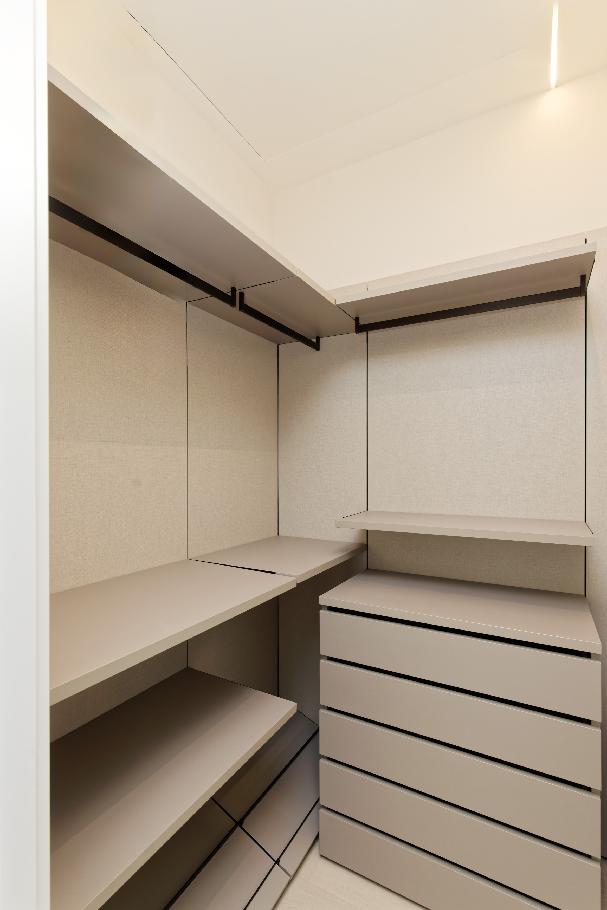Walk-in closet with bronze shelving