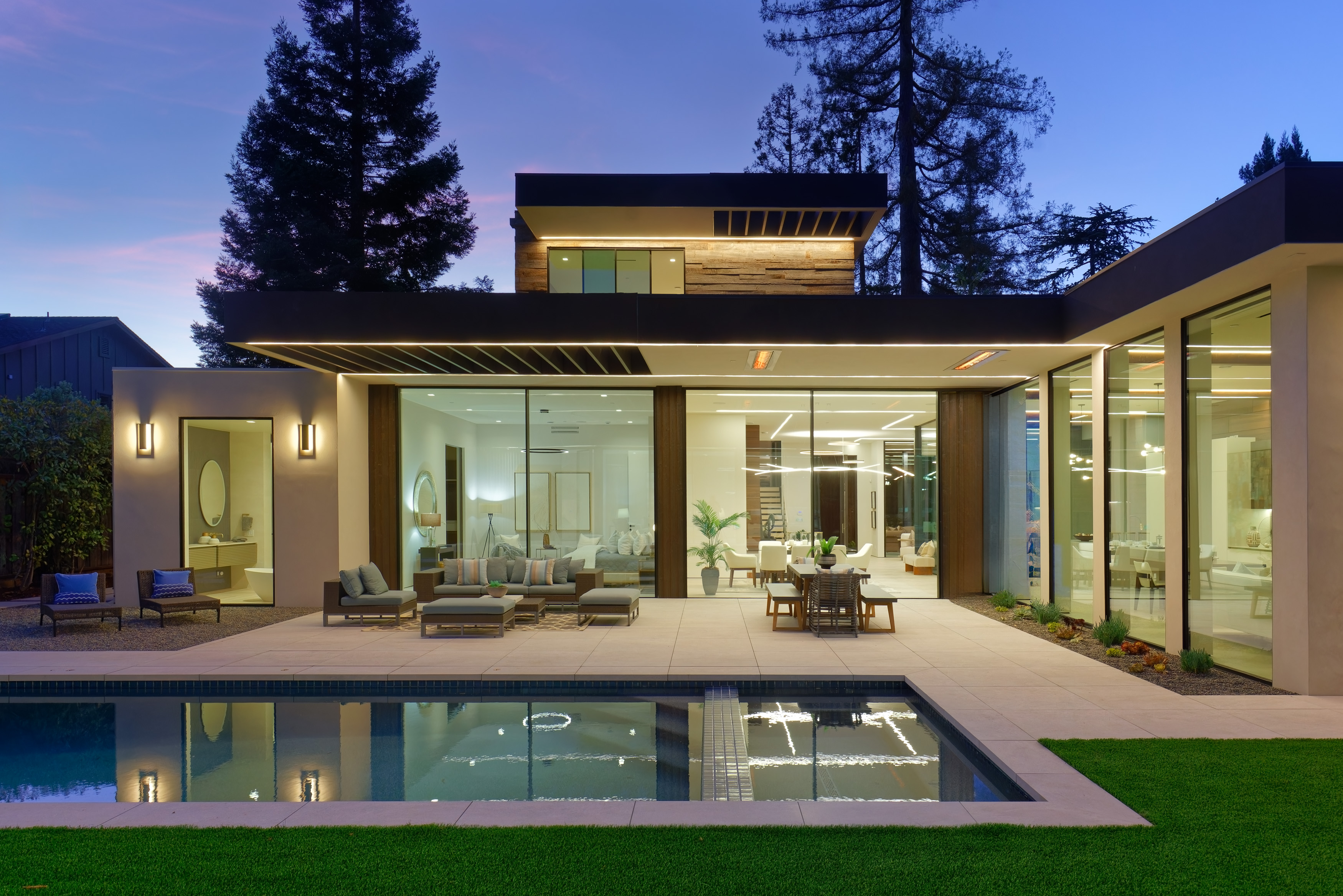Garden pavilion at twilight — pool elevation