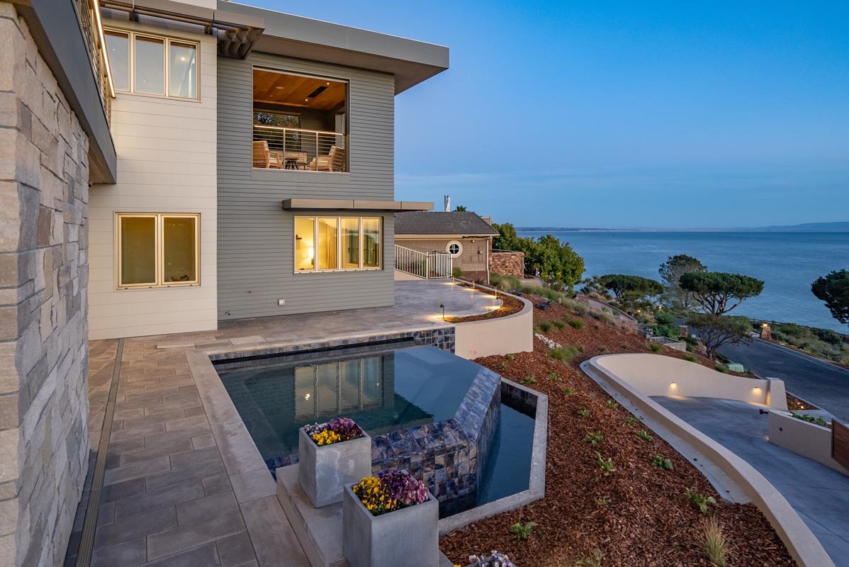 Spa terrace on the water side, set into the stone base of the house